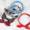A collection of boho paisley elastic hair headbands in black, white, and blue are displayed on a white background.