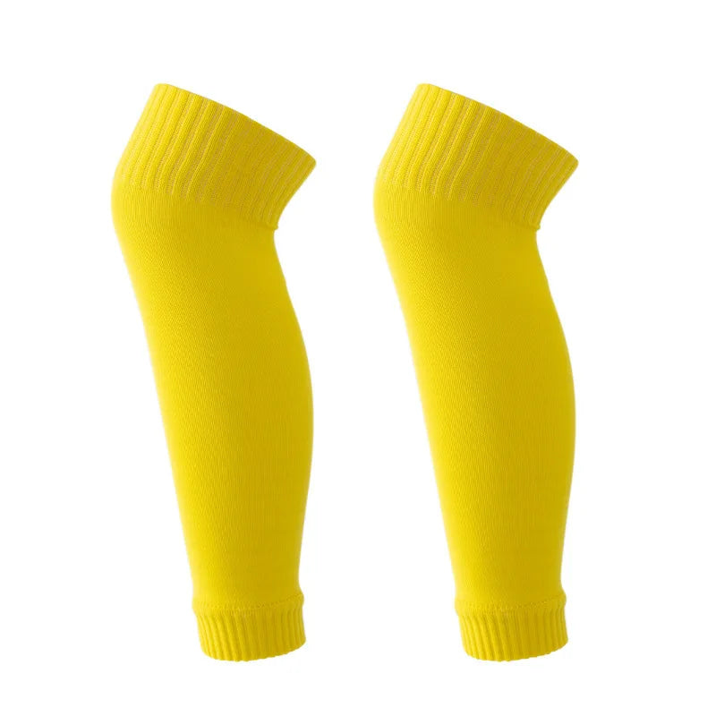 A pair of bright yellow compression football socks for athletes.