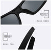 Close-up view of black vintage rectangle sunglasses showing bracket and hinge designs.