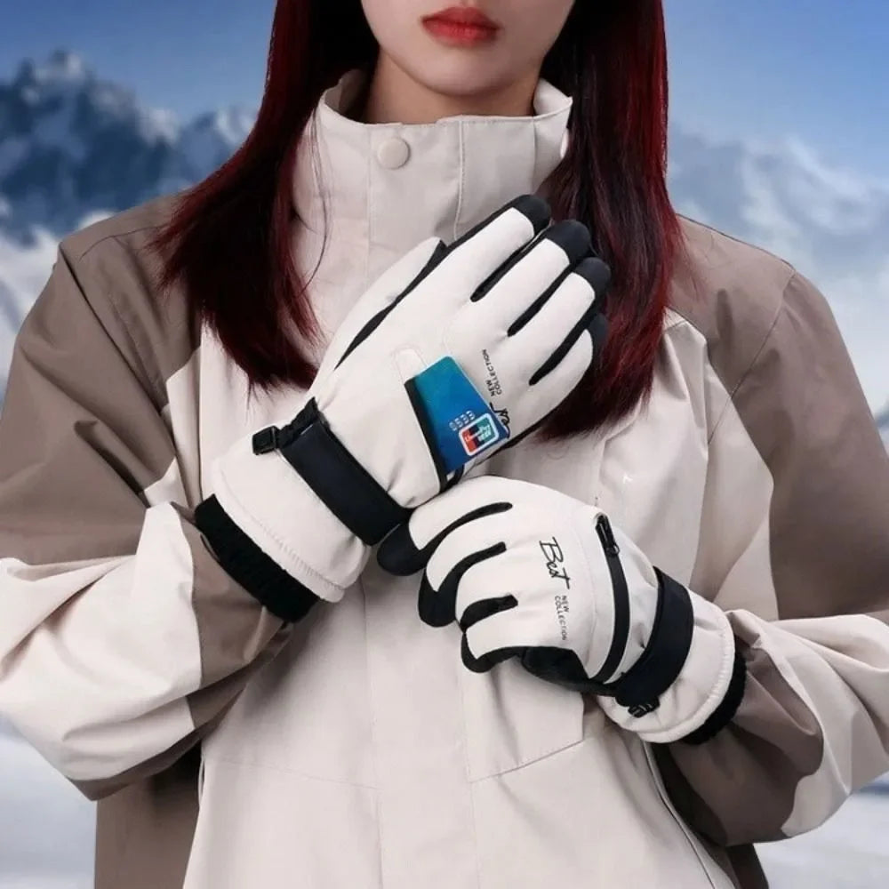 A close-up of a person wearing beige outerwear and white thermal winter ski gloves with black accents.