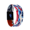 A colorful stretch silicone wristband bracelet featuring a wave pattern in blue, red, and white.