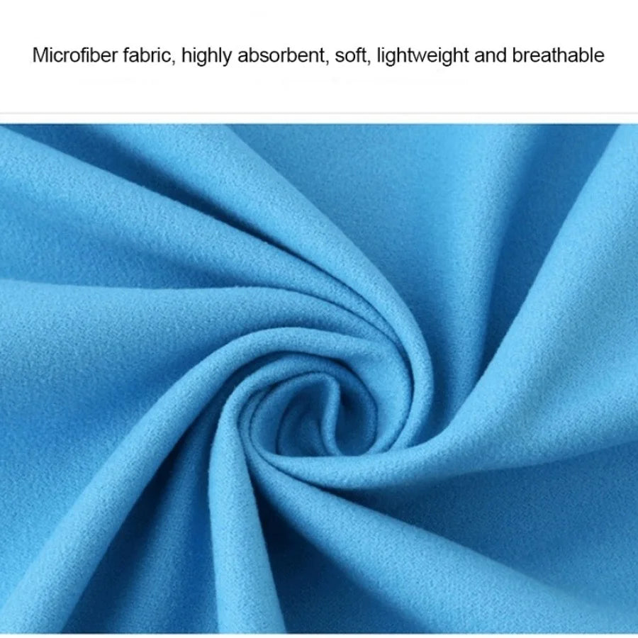 A close-up of a bright blue microfiber fabric tightly rolled into a sphere.