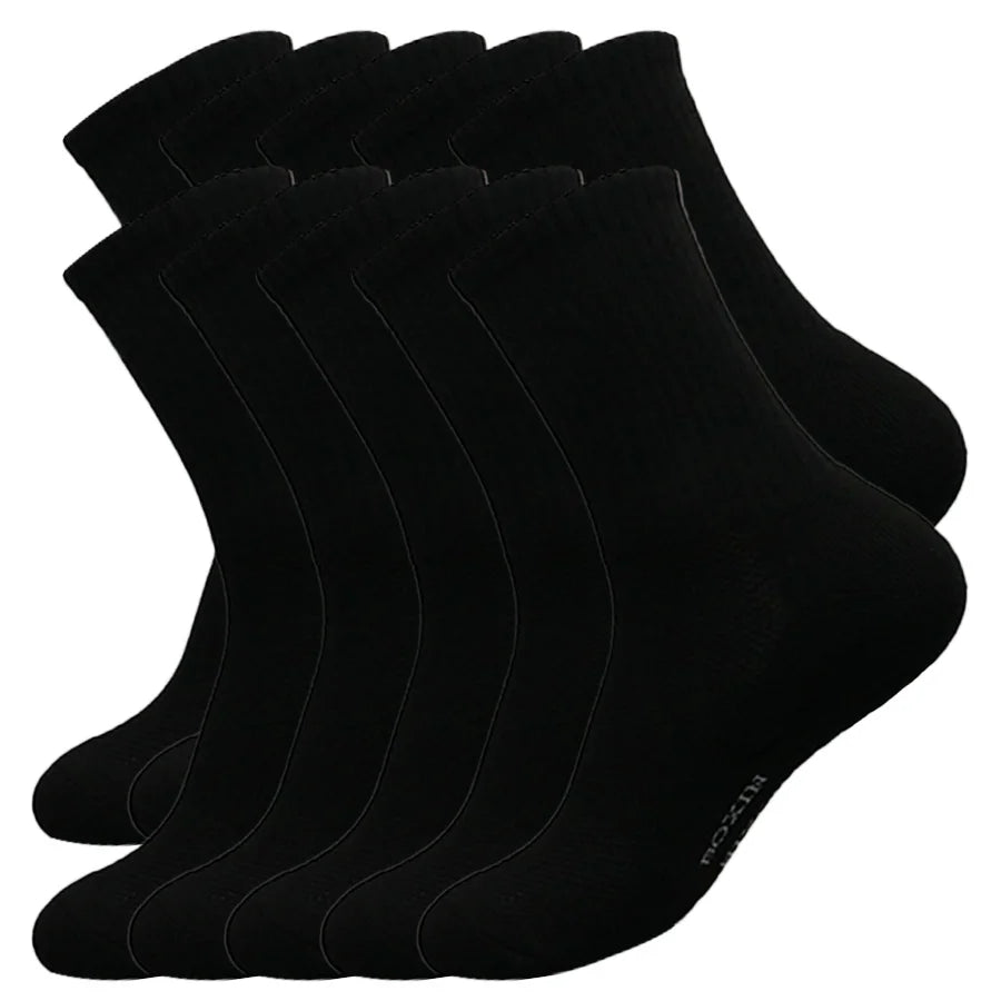 A stack of black men's essential warm socks for outdoor activities.