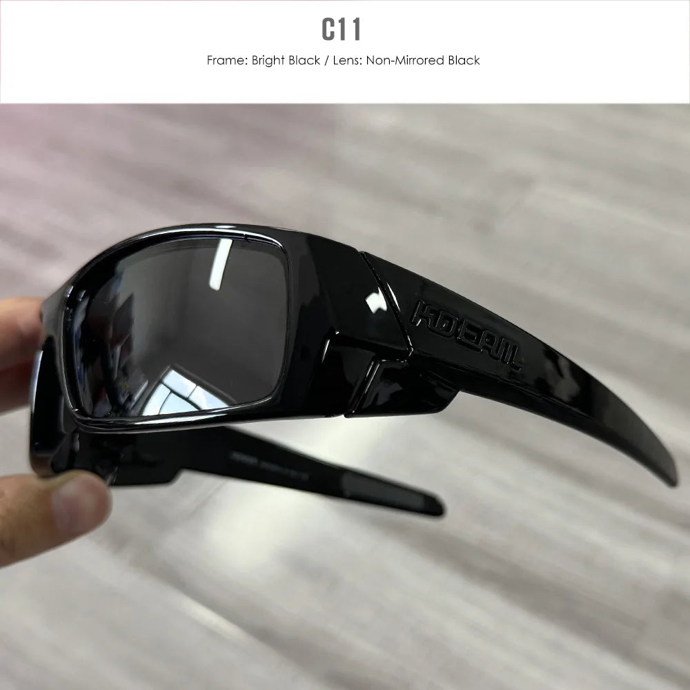 A close-up view of black sports sunglasses with a dark lens and a black frame.