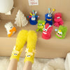 A set of colorful cartoon expression knit socks featuring characters like a blue monster, green creature, and pink animal.