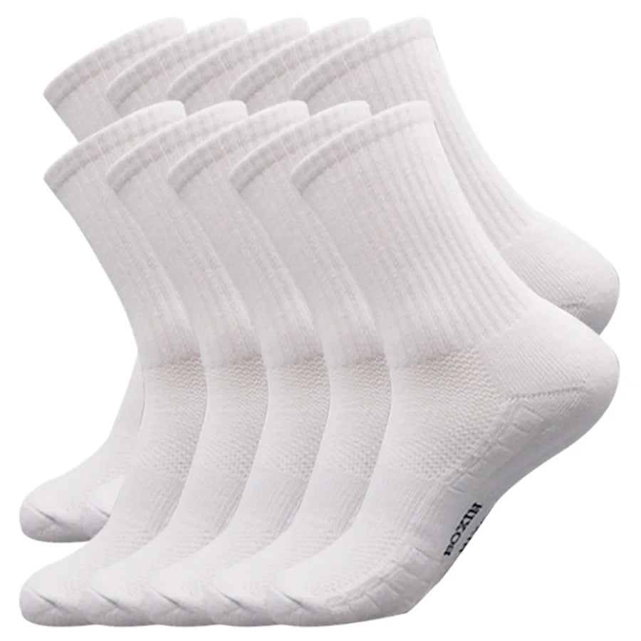 A stack of white men's essential warm socks for outdoor activities