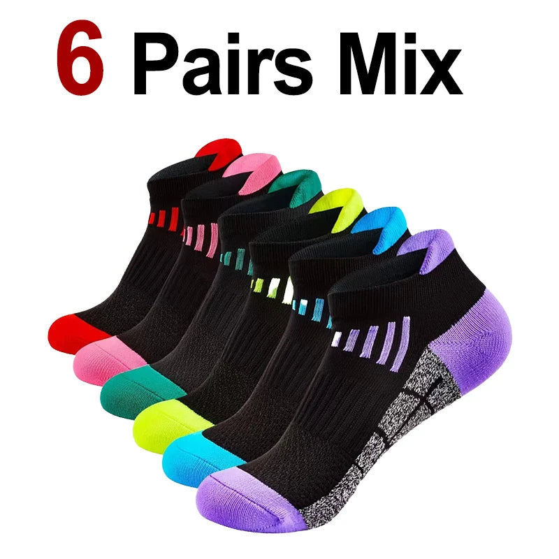 A collection of six pairs of multi-colored knit sports socks displayed together.