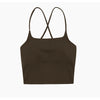 A black women's performance tracksuit set top with criss-cross straps
