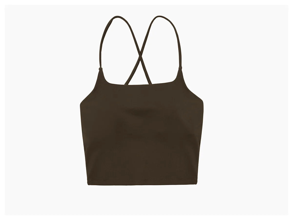 A black women's performance tracksuit set top with criss-cross straps