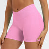 A model wearing bright pink seamless high-waist yoga leggings.