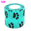 A roll of teal elastic bandage tape patterned with black fruit shapes for joints.