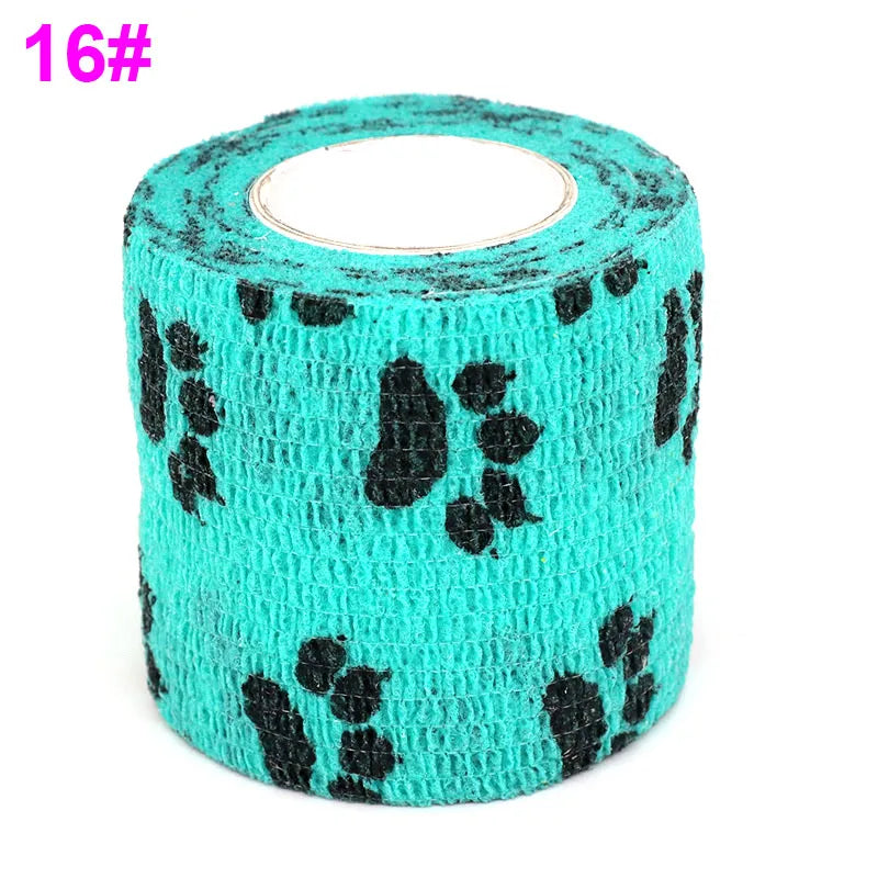 A roll of teal elastic bandage tape patterned with black fruit shapes for joints.