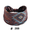 A dark brown patterned boho cotton turban headband with a bow detail.
