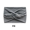 A gray fabric headband tied in a knot, suitable for bohemian style.