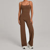 A woman wearing a brown high-waist yoga and fitness tracksuit set with matching top and pants.
