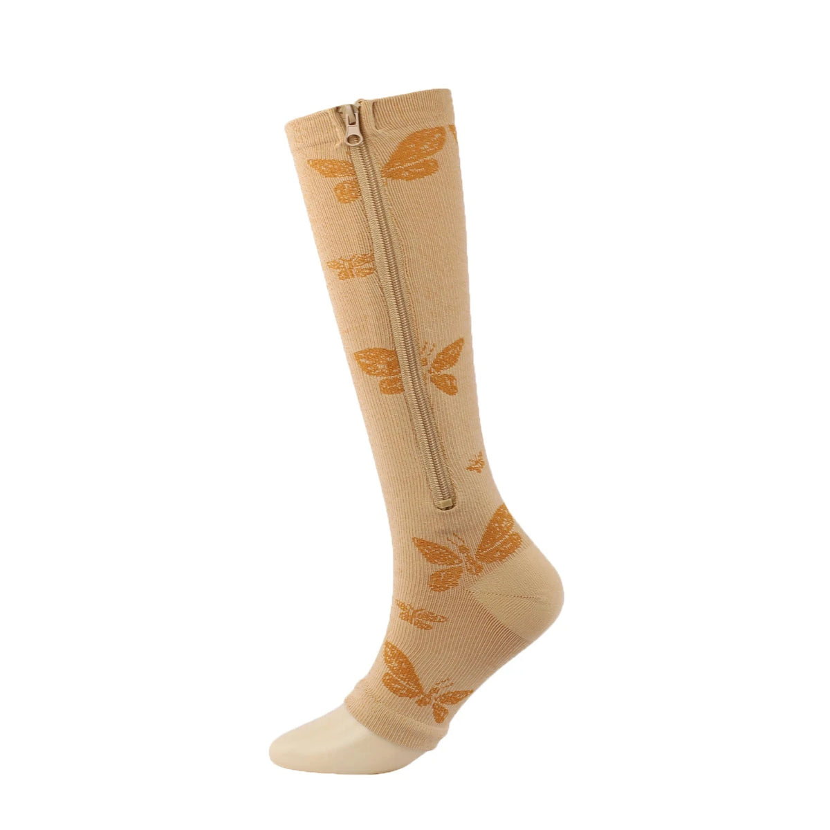 A beige compression sock with orange leaf patterns, shown standing upright.