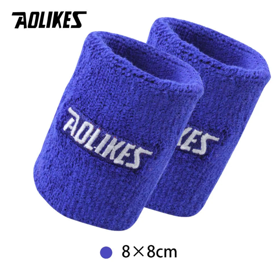 A pair of royal blue knitted sport wristbands for activewear