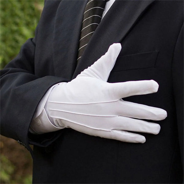 A person wearing a black suit jacket is shown holding a white cotton handling glove with an outstretched hand.