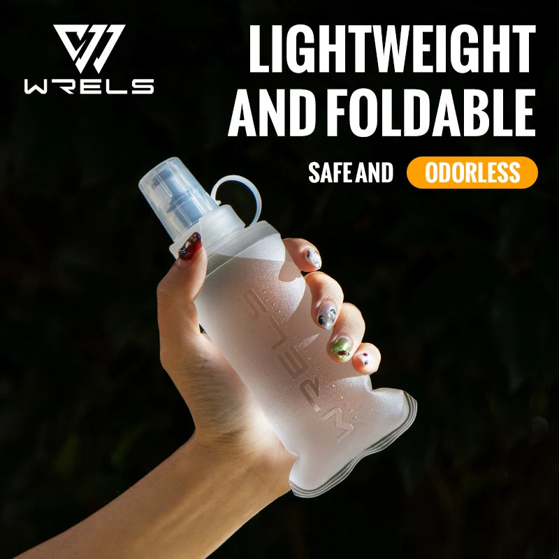 A hand holds a clear, lightweight and foldable silicone water flask for outdoor activities.