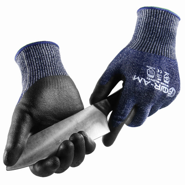 A pair of dark blue and black durable cut-resistant work gloves holding a silver knife.