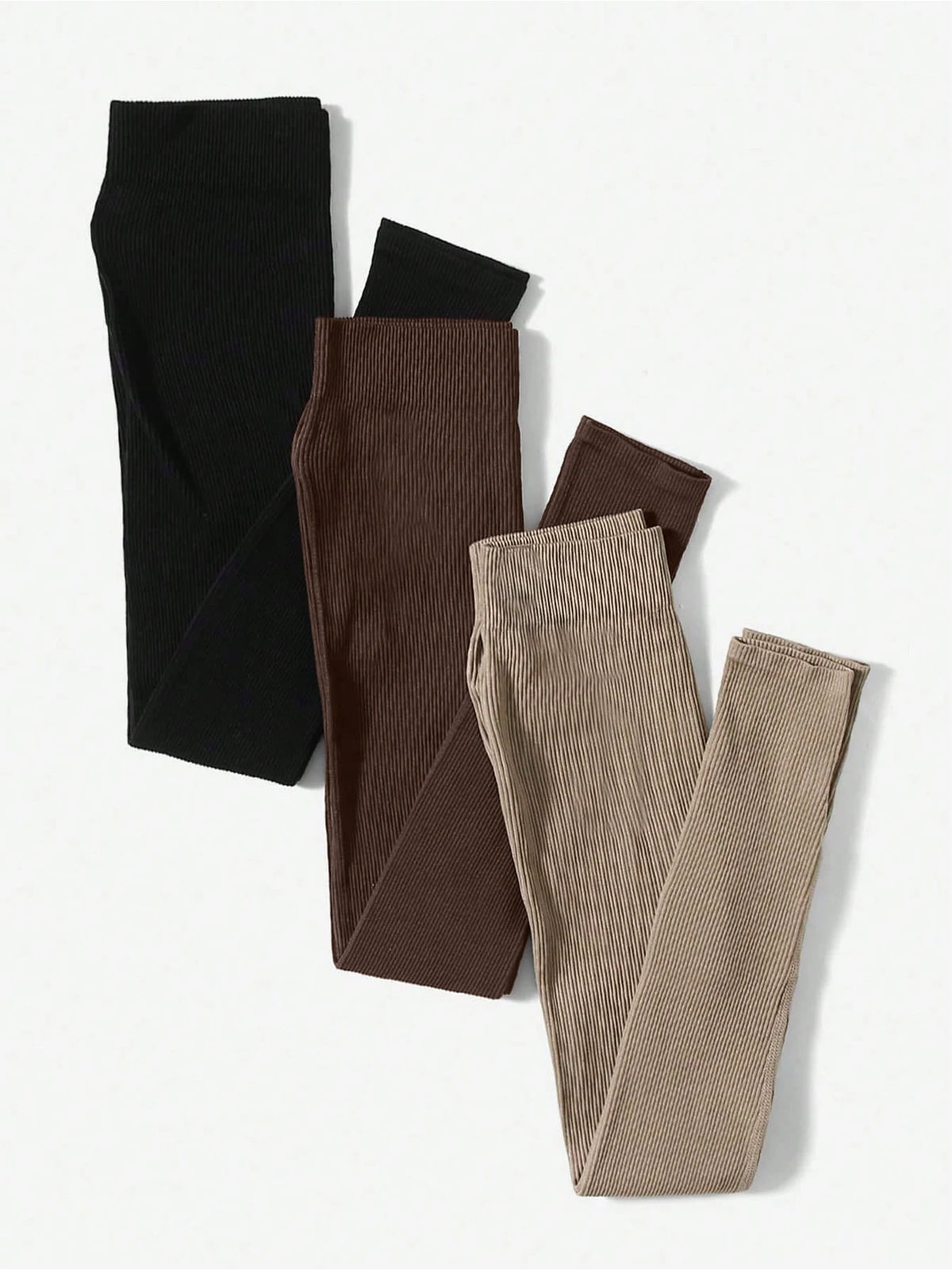A set of three seamless high-waisted yoga leggings in black, brown, and beige.