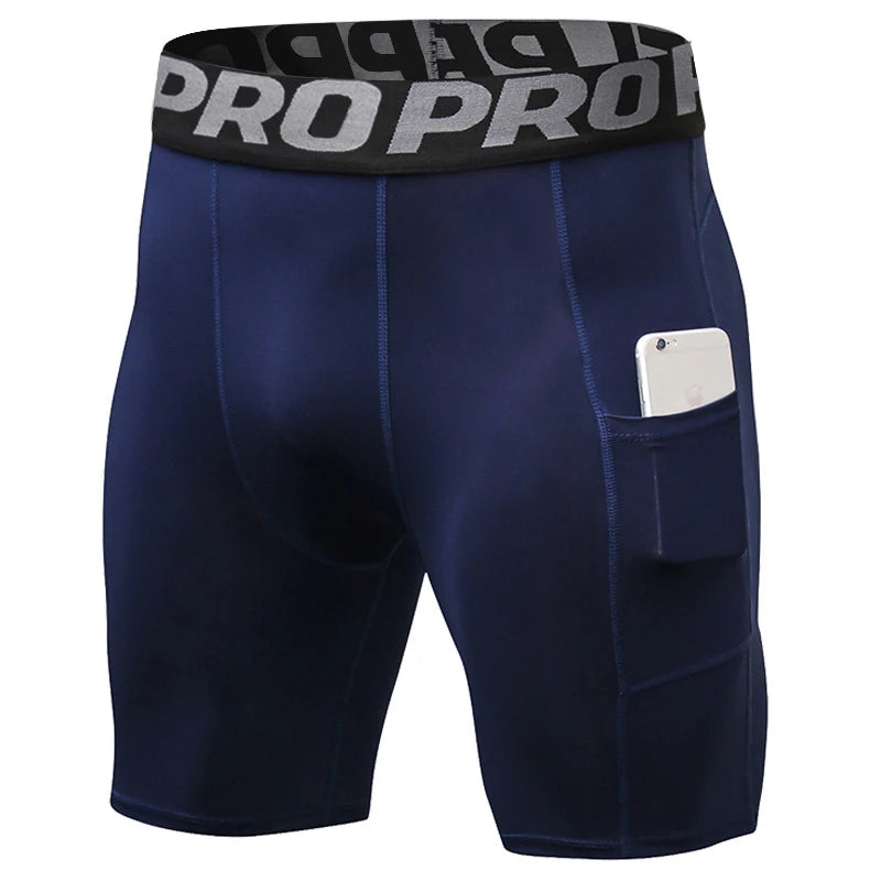 Shorts deportivos de compresión azul marino para hombre con elástico negro y bolsillo lateral.