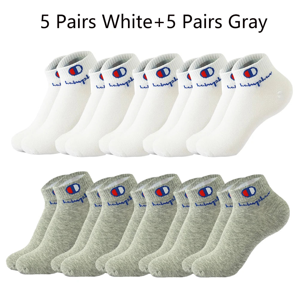A collection of ten pairs of ankle socks, five white and five gray.