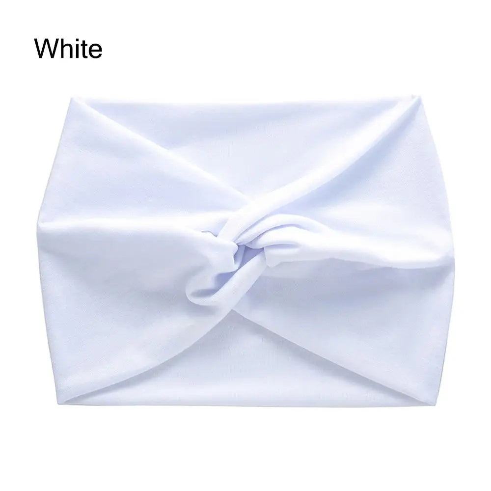 White cross-knotted fabric headband for yoga and workout