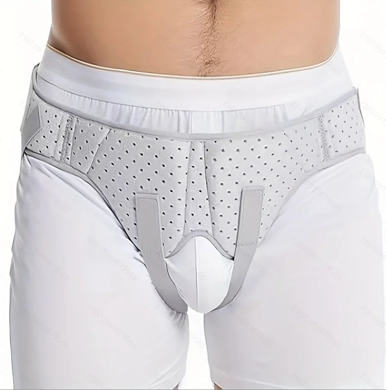 White hernia support belt worn around the waist and groin area.