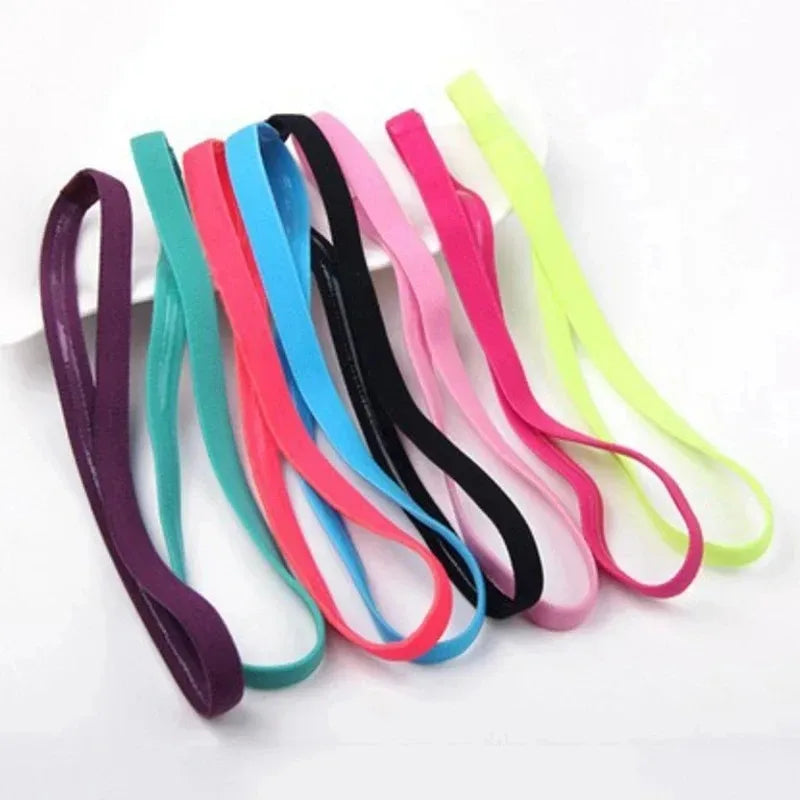 A pack of five colorful elastic silicone sports headbands in various shades including pink, blue, green, and yellow.