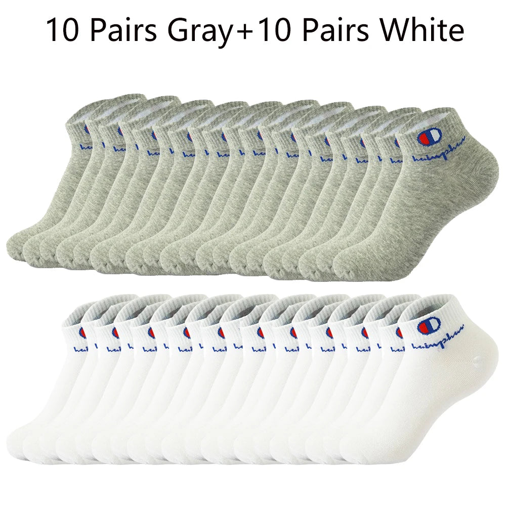 A collection of 10 pairs of gray and 10 pairs of white ankle socks laid out in rows.