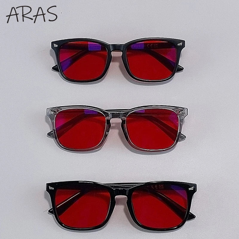 A set of three pairs of ARAS anti-blue light glasses in red and purple lenses displayed against a white background.