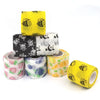 Rolls of colorful fruit pattern elastic bandage tape including yellow, black skull, and white designs