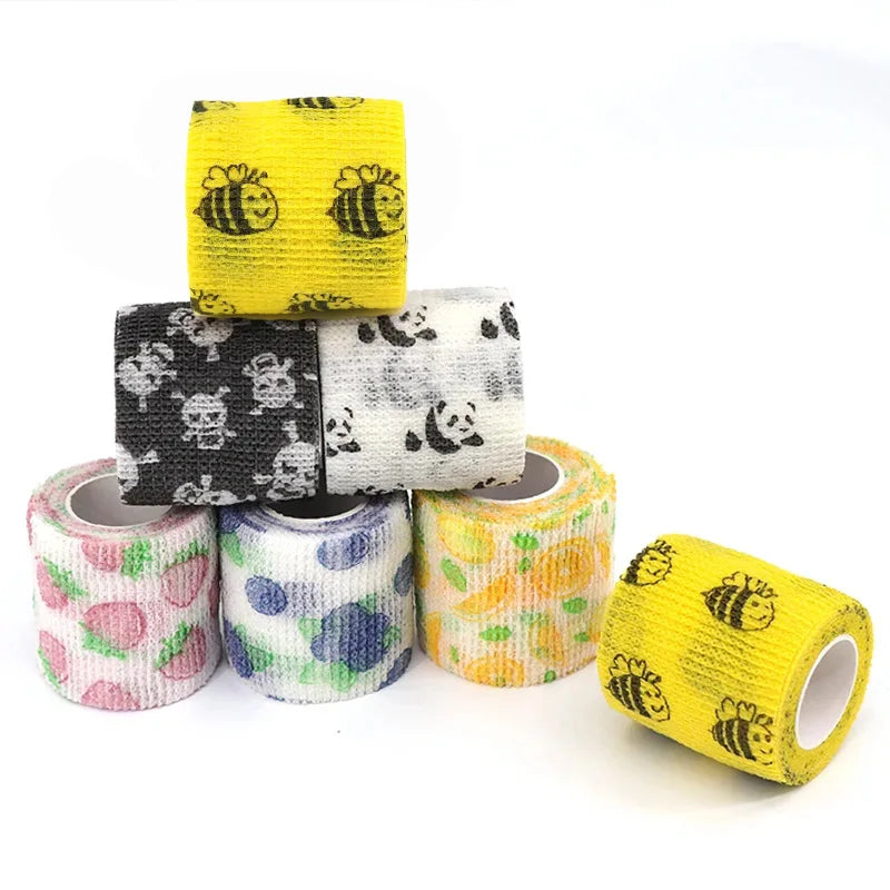 Rolls of colorful fruit pattern elastic bandage tape including yellow, black skull, and white designs