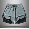 Gray athletic shorts with black trim and drawstring shown flat lay.