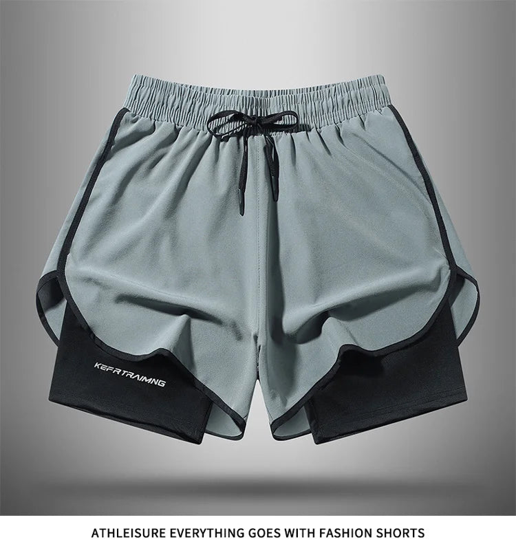 Gray athletic shorts with black trim and drawstring shown flat lay.