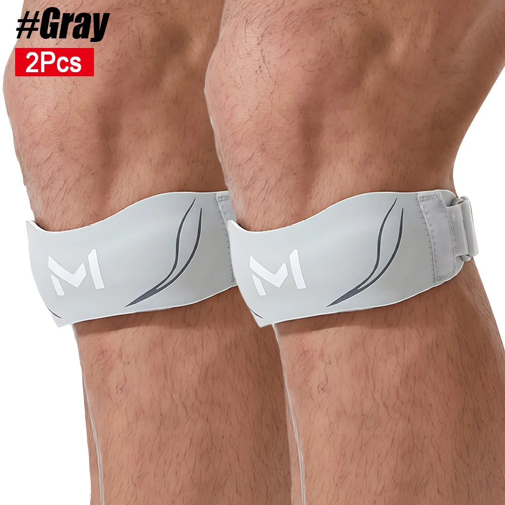 Gray knee brace with two pieces shown on a leg for patellar tendon support