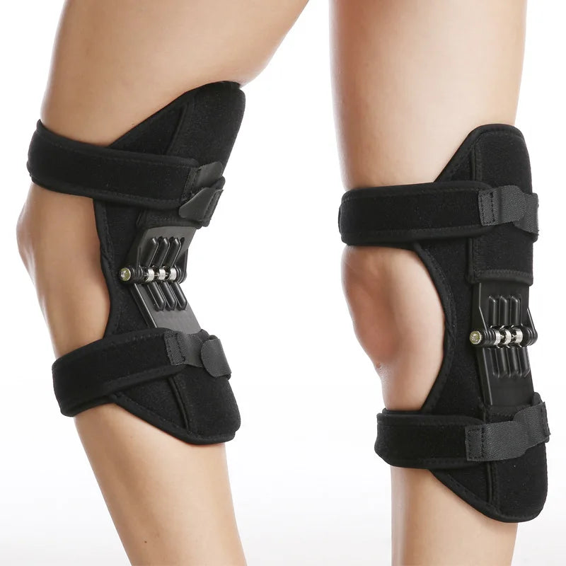 Black ergonomic knee protection booster pads worn on the lower leg.
