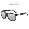 A pair of black sunglasses with silver mirrored lenses and a black frame.