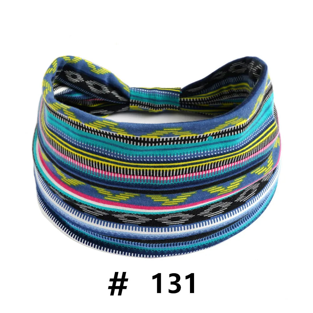 A colorful, striped knitted headband with a bow, featuring various shades of blue, green, yellow, and black.
