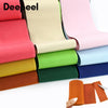 A collection of colorful, adjustable elastic bands or ribbons in various shades are displayed on a white surface.