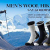 A display of men's wool hiking socks in various colors and styles against a mountainous outdoor backdrop.