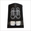 Black reusable non-woven shoe storage bag with white outline of a shoe and an actual shoe inside