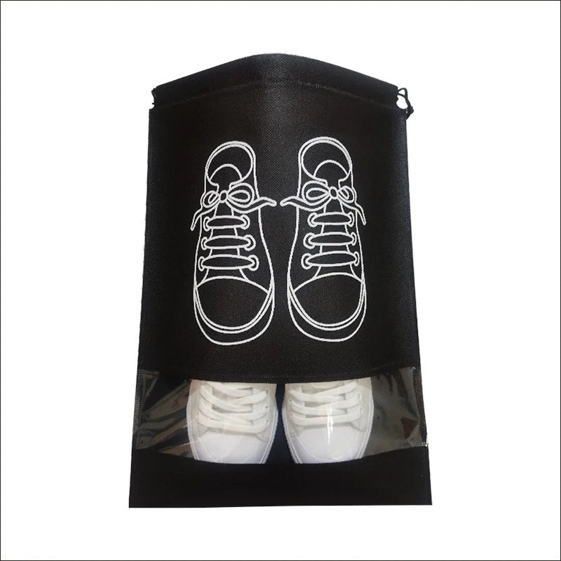 Black reusable non-woven shoe storage bag with white outline of a shoe and an actual shoe inside