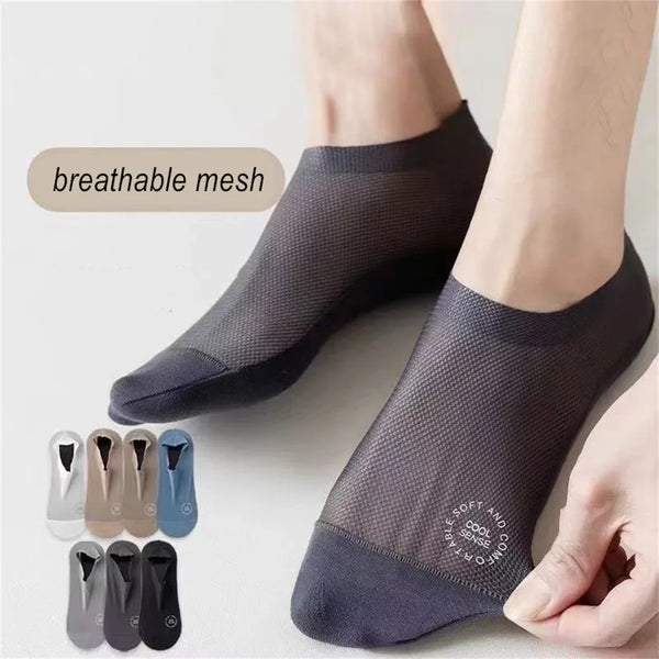 A pair of dark gray breathable mesh socks being worn on a foot, with various color options displayed nearby.
