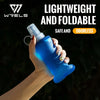 A hand holds a lightweight and foldable blue silicone hydration flask against a dark background.