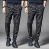 Men's camouflage elastic waist drawstring pants shown on a model.