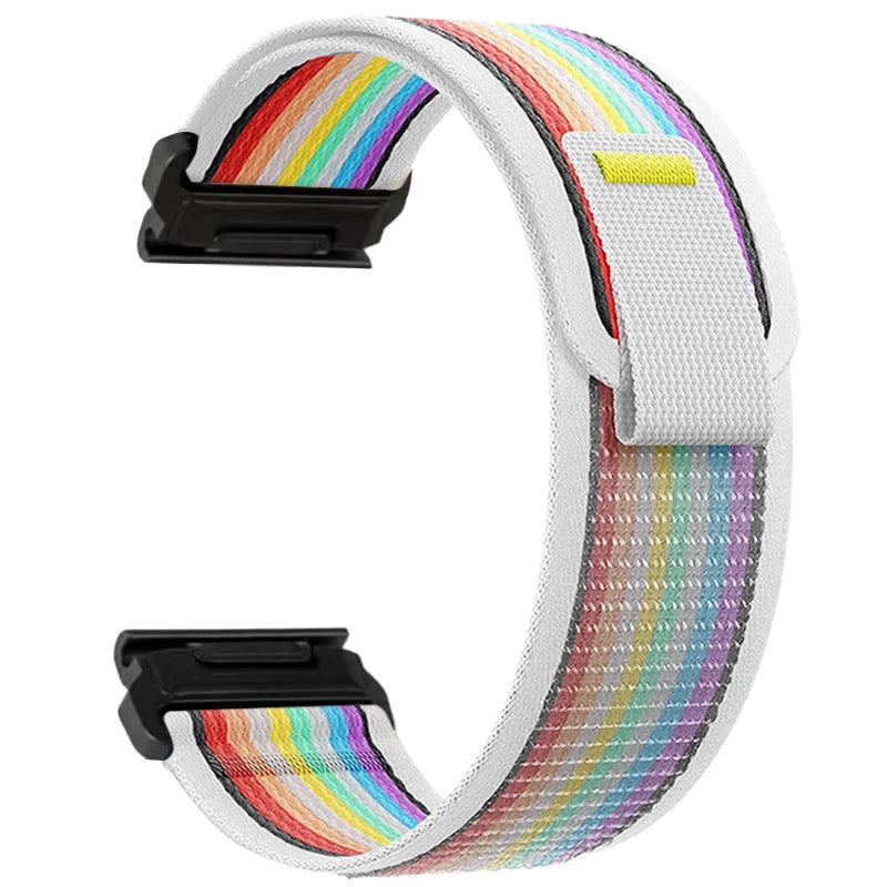 A white nylon strap with a rainbow pattern and black buckles for an adjustable sports watch.