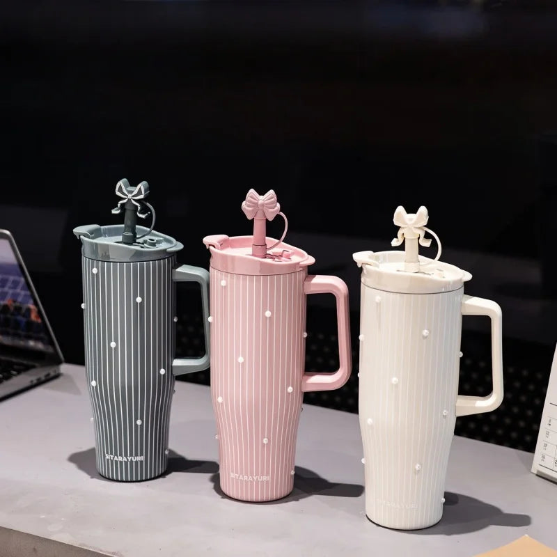 Three versions of the Pearl Inlay Insulated Thermos Mug in gray, pink, and white are displayed on a surface.