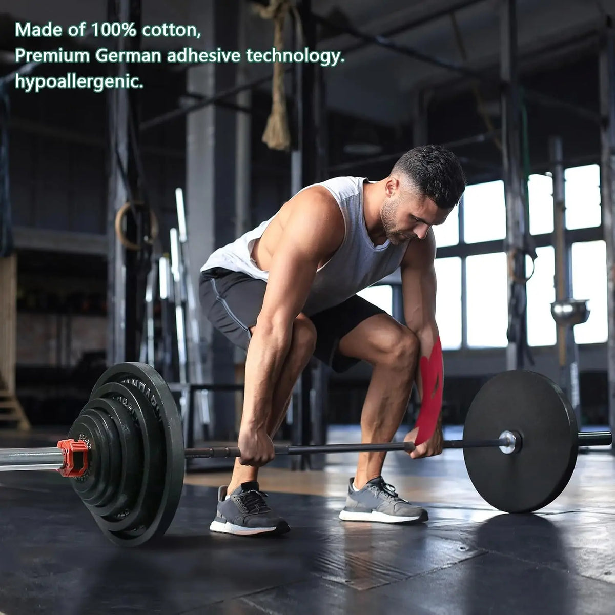 A muscular man performs a squat exercise using a barbell and weights in a gym setting.